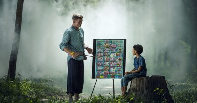 teacher teaching student with display board outside