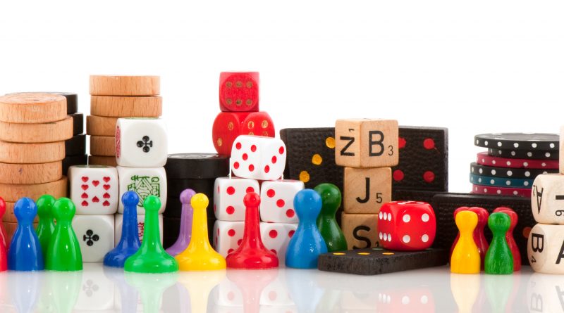 dice and game pieces colorful stock photo