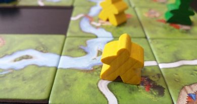 meeples on carcassonne board game board