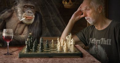 pensive man and monkey playing chess