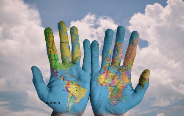 map of the world on hands